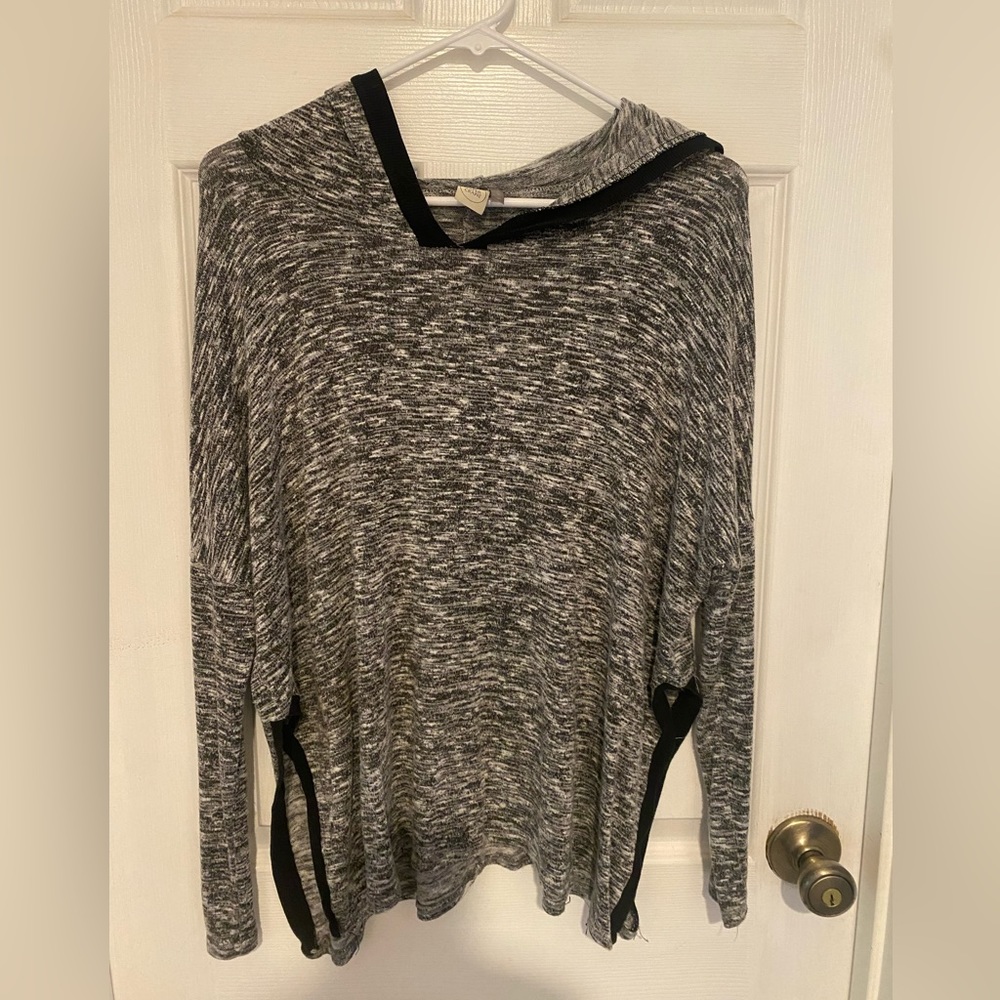 Size S black and white lightweight sweater w/ slits up the side 
By Paper Crane